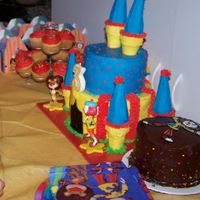 Jojo Cake, Mini Cake, & Cupcakes Vanilla JoJo castle, chocolate mini cake and vanilla cupcakes.