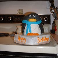 3D Penguin Penguin cake covered in fondant sitting on ice!