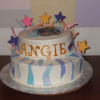 Hanna Montana Birthday Cake Chocolate with chocolate pudding and Crusting buttercream. Edible image stars are chocolate the curly ribbon and name is gumpaste. Wavy cut...