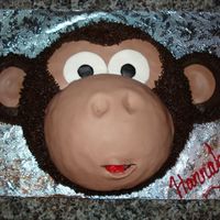 Hannah's Monkey Cake Monkey Cake inspired by several CCer's. 8 inch Round with half sports ball pan for muzzle (which was covered in fondant) Buttercream...