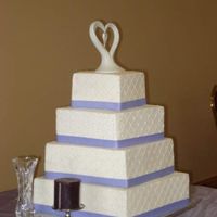 Nicole's Wedding Square cakes, buttercream, diamond imprint sheet, sugar dragess at inersections, real ribbon. This bride was an absolute doll to work with...