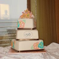 Chantal's Wedding Fondant covered, brushed embroidery hibiscus in coral and teal buttercream (freehanded), real ribbon, gumpaste lilies for topper. ALmond...