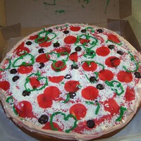 Pizza!! Fun cake made for a little girl's birthday pizza party! Buttercream iced with fondant topping!! The local pizza shop gave me the box!...