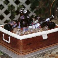 Cooler Cake This is my own design. I created this cake for my son-in-law's grooms cake. It is chocolate and yes the beer bottles are real and full...