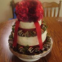 2Nd Wedding Cake Buttercream icing with chocolate fudge cake filled with cookies n cream. Edible pearls and chocolate covered strawberries.