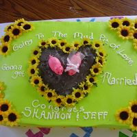 Mud Pit Of Love Bride to be LOVES pigs and sunflowers. So made pigs out of fondant and use silk sunflowers....