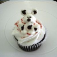 Dalmation Cupcake Chocolate fudge chocolate chip cupcake, vanilla buttercream frosting, and candy melt molded dalmation puppy. Made to go with firetruck cake...