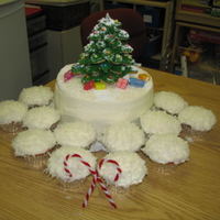 Christmas Cake This was a Southern Living Carrot Cake, with cream cheese frosting. The "snow" is coconut and the tree is made from a tree cookie...