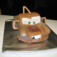 'mater Cake I made this for a big "Cars" fan. Brown tinted fondant, chocolate donut wheels, Kitkat and Reece's pbc "engine",...