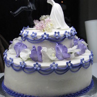 No Escape Wedding Cake Chocolate and vanilla layers, with buttercream frosting and filling. Bride picked out the flowers from her boquet to incorporate into the...