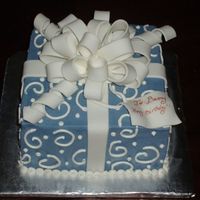 Gift Box Blue gift box cake covered in buttercream with fondant ribbon and bow. (first fondant bow i've ever made). 3 layer 8 inch square cake...
