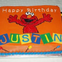 Elmo Birthday 11x15 WASC cake. Orange buttercream icing, fondant blocks. Used my project-a-scope projector to put on the image. My son loved it!