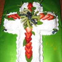 Bountiful Fruit Cross made with Whipped icing, topped with fresh fruit