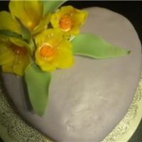 Tulips And Heart Yellow tulips on a purple fondant covered heart cake.