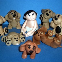 Puppies The little boy and all the puppies are all made from gumpaste