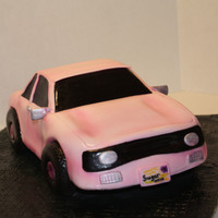 3D Sculpted Car Cake 3D car cake covered in fondant and tehm highlighted with air brushing