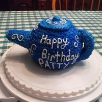 Tea Pot This cake was for my mom!! The cake was made from a round pan. The spout was a sugar cone and the handle was Rice Krispies. Everything else...