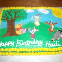 Winnie The Pooh I made this for my daughter's 4th birthday. The cake is strawberry with buttercream. The characters are from flash cards I bought, and...