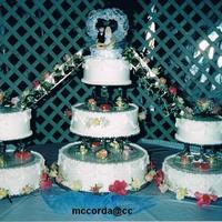 Wedding 2002 I did this for a co-worker's daughter. I used wine glasses as pillars and had pieces of plexiglass cut to be the base plates under the...