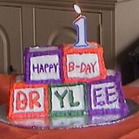 Stack Of Blocks This was my daughter's first birthday cake. We were in the middle of a move and I had no supplies. This one was an easy one to do with...