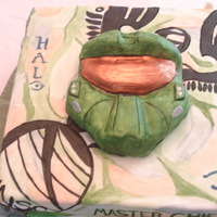 Halo Halo cake for son's birthday. Marble cake with fondant cover. Halo helmet shaped rice cereal, covered in fondant. Base cake hand-...