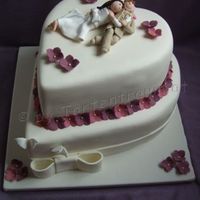 Hydrangea Wedding Cake Cake covered in sugarpaste, flowers are flower-paste. The couple are polymer clay.