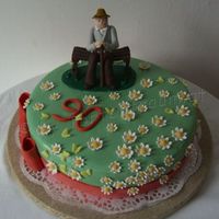 Grandpas 90Th Birthday Cake covered in sugarpaste, flowers are sugarpaste/flowerpaste mix. The Grandpa are polymer clay.