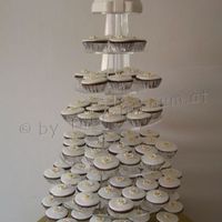 Cupcake Arrangement For Wedding Cupcakes covered in sugarpaste. The flower are a flower-paste/sugar paste mix.