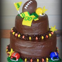 Fall And Football Baby Shower I made this cake for a baby shower that was themed Fall and Football. Cake is chocolate with cookies and cream filling.