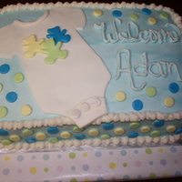 Onesie Cake Baby shower cake for a friend. Chocolate cake, cookies and cream filling, buttercream icing, fondant accents.