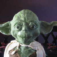 3D Yoda Cake This is by far one of my favorite cakes!! I am so proud of how well it turned out!! The head is a syrofoam ball covered in mmf and sculpted...