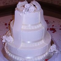 Cream Color Wedding Cake Italian buttercream is the overall frosting. Small round dots piped with ItaliaItalian buttercream (tip #3 Wilton) and bow made of 50%...