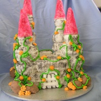 Krystyna's Castle Cake Dairy free chocolate cake with buttercream icing and powder painted over icing ,Vines and flowers are royal icing