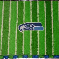 Go Seahawks My son's football team was the Seahawks so this was done for the end of season banquet. BC icing, fondant letters and chocolate...