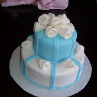 Small Quinceanera Cake Fondant covered cake. From the Wilton course 3.