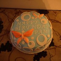 Birthday Butterflies I made this cake for my roomate on her birthday. It is BC with Fondant accents. The butterflies are fondant painted with pink gel icing.