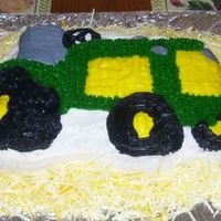 Tractor Cake This was the first specialty cake I ever did...and I'm afraid it shows. I used the Wilton tractor pan, obviously, and BC frosting....