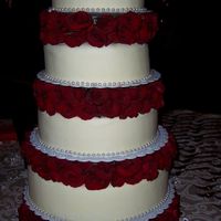 My First Wedding Cake White Chocolate Cream Cheese frosting, covering carrot cake, white chocolate w/raspberry filling, and chocolate w/chocolate buttercream...