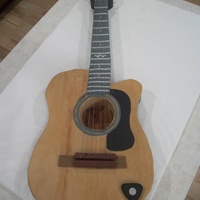 Guitar Groom's Cake This was made to match the groom's guitar. Completely covered in modeling chocolate.