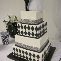 Black & White Wedding Cake All buttercream with chocolate accents and silk ribbon.