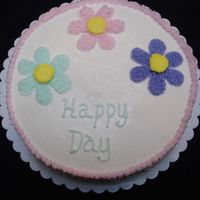 First Cake- Flowers Single layer cake with flowers, decorated with star tip