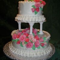 My First Wedding Cake This was my first experience with making a tiered cake. Each tier was a 2 layer yellow cake with buttercream frosting. The roses were...