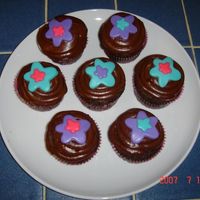 Janelle's Flower Cupcakes I made these cupcakes for my friend Janelle's "At Home" party. These are triple chocolate cupcakes with chocolate frosting....