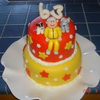 Blase's Birthday Cake The bottom layer is chocolate cake with vanilla icing and the top layer is vanilla cake with vanilla icing. I used MM fondant to make the...