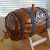 Oktoberfest Birthday Beer Keg It ended up harder than it looked to get the curve of the barrel planks right. Bottom half is styrofoam, top half is cake. Covered in MMF...