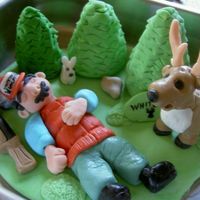 Deer And Hunter All fondant. A special thanks to aine2 for technique and the women who inpired me with her cake of a sleeping hunter, unfortunatly I cant...
