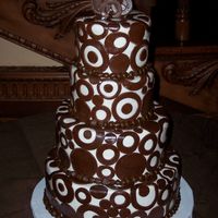 Godfrey - Eltora Wedding Cake I was so excited to do this cake!!! 4", 6", 8" and 10" layers. Covered in fondant and brown, fondant circles. When I...