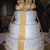 50Th Anniversary 6" french vanilla; 9" milk chocolate/french vanilla marble; 12" red velvet. Entire cake is done in butter cream with random...