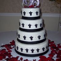 Geissele - Bideau Wedding Cake 6", 8", 10" and 12" rounds. Cake is covered in MMF. Decorates are black ribbon, molded fleur-de-lis (in honor of the...