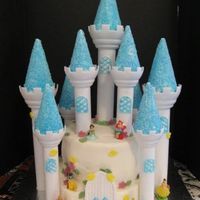 Princesses Castle Cake for my daughter's 5th birthday. Wilton castle kit. Princesses are from Disney "Kinder" Eggs.